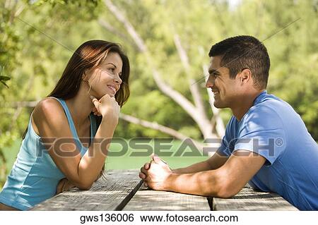 Close-up of a mid adult man with a young woman View Large Photo Image Stock Photograph - Close-up of a mid adult man with a young woman. Fotosearch