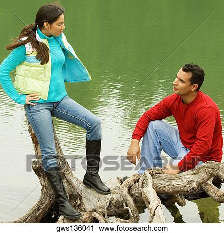 High angle view of a young couple looking at each other View Large Photo Image Stock Image - High angle view of a young couple looking at each other. Fotosearch