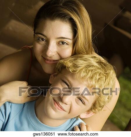 Portrait of a brother and his sister smiling View Large Photo Image Stock Image - Portrait of a brother and his sister smiling. Fotosearch