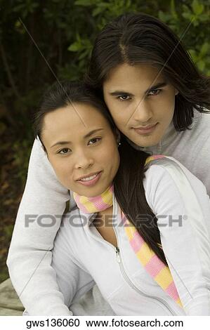 Portrait of a young couple smiling View Large Photo Image Stock Image - Portrait of a young couple smiling. Fotosearch