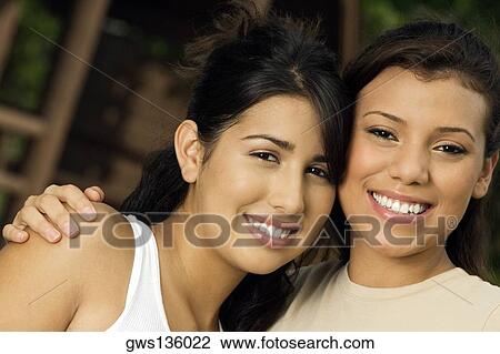 Portrait of two teenage girls smiling View Large Photo Image Stock Image - Portrait of two teenage girls smiling. Fotosearch