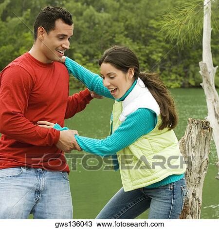 Side profile of a young couple smiling View Large Photo Image Stock Image - Side profile of a young couple smiling. Fotosearch