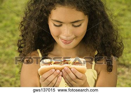Close-up of a girl holding a sandwich View Large Photo Image Stock Photography - Close-up of a girl holding a sandwich. Fotosearch