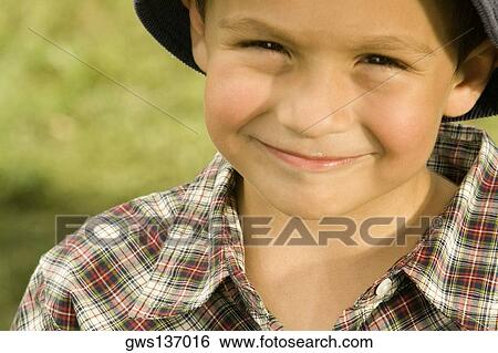 Portrait of a boy holding a chocolate View Large Photo Image Stock Photograph - Portrait of a boy holding a chocolate. Fotosearch