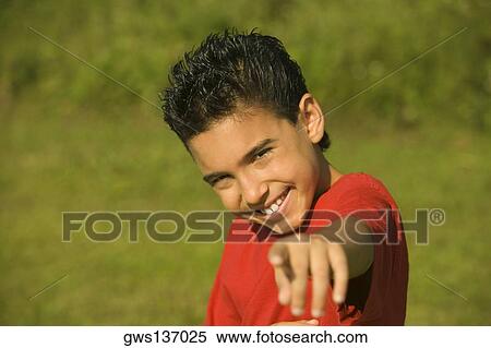 Portrait of a boy pointing forward View Large Photo Image Stock Photography - Portrait of a boy pointing forward. Fotosearch