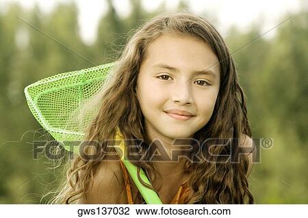 Portrait of a girl holding a butterfly net View Large Photo Image Stock Image - Portrait of a girl holding a butterfly net. Fotosearch