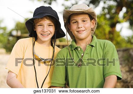 Stock Image - Portrait of two brothers smiling. Fotosearch