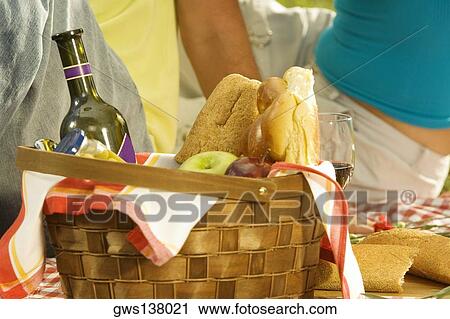 Close-up of a bottle with fruit and buns in a basket View Large Photo Image Stock Image - Close-up of a bottle with fruit and buns in a basket. Fotosearch
