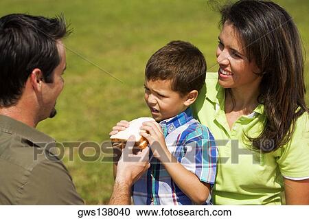 Close-up of parents and their son View Large Photo Image Stock Image - Close-up of parents and their son. Fotosearch