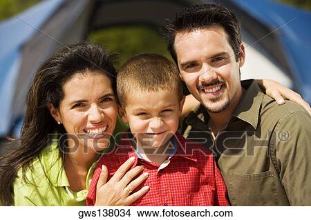 Picture - Portrait of a boy smiling with his parents. Fotosearch