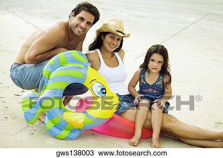 Portrait of parents and their daughter on the beach View Large Photo Image Stock Image - Portrait of parents and their daughter on the beach. Fotosearch