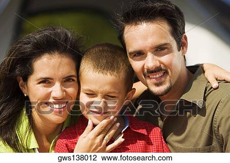 Stock Image - Portrait of parents and their son smiling. Fotosearch
