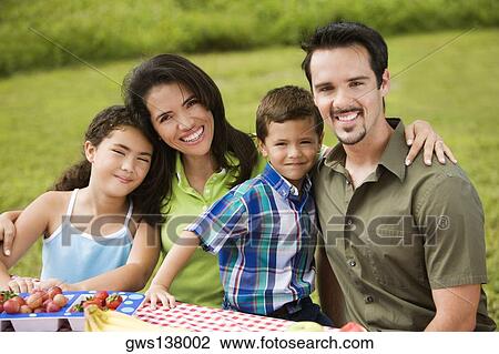 Portrait of parents with their son and daughter smiling View Large Photo Image Stock Image - Portrait of parents with their son and daughter smiling. Fotosearch