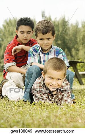Three boys in the garden View Large Photo Image Stock Photo - Three boys in the garden. Fotosearch