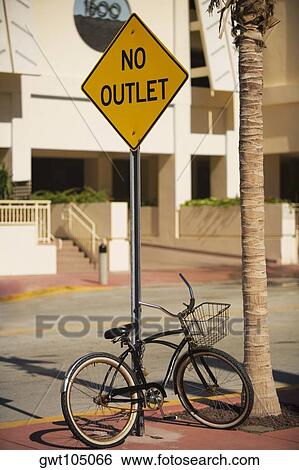 Bicycle parked against an information board, Miami, Florida, USA View Large Photo Image Stock Photograph - Bicycle parked against an information board, Miami, Florida, USA. Fotosearch