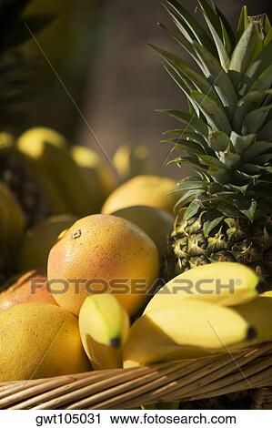 Stock Image - Close-up of fruit in a wicker basket. Fotosearch