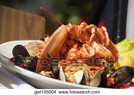 Close-up of seafood in a plate View Large Photo Image Picture - Close-up of seafood in a plate. Fotosearch