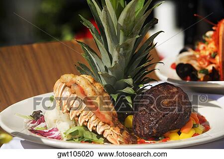 Close-up of seafood in a plate View Large Photo Image Stock Image - Close-up of seafood in a plate. Fotosearch