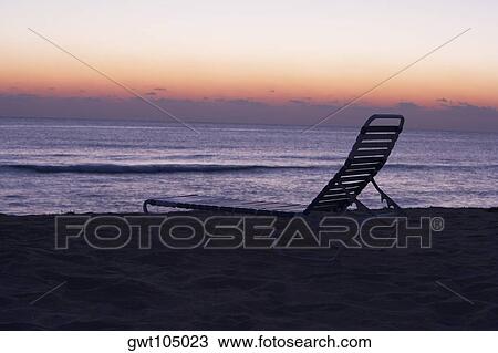 Silhouette of a lounge chair on the beach, Miami, Florida, USA View Large Photo Image Stock Image - Silhouette of a lounge chair on the beach, Miami, Florida, USA. Fotosearch