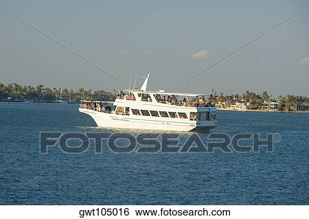 Tourists on a yacht in the sea, Miami, Florida, USA View Large Photo Image Stock Photograph - Tourists on a yacht in the sea, Miami, Florida, USA. Fotosearch