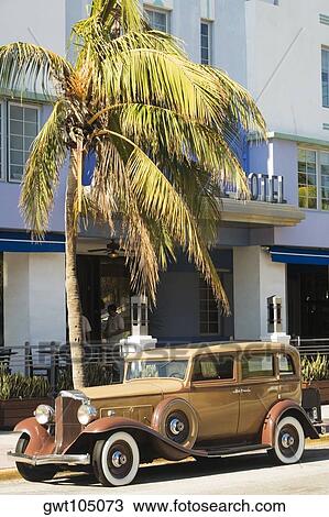Vintage car parked in front of a hotel, Miami, Florida, USA View Large Photo Image Stock Image - Vintage car parked in front of a hotel, Miami, Florida, USA. Fotosearch
