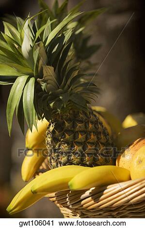 Close-up of fruit in a wicker basket View Large Photo Image Stock Image - Close-up of fruit in a wicker basket. Fotosearch