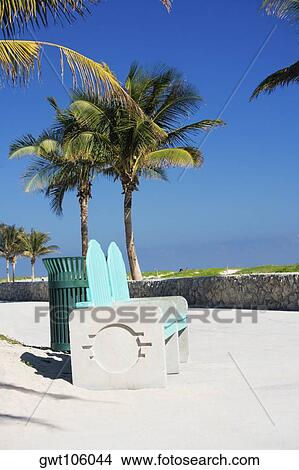 Garbage bin near a bench, Miami, Florida, USA View Large Photo Image Picture - Garbage bin near a bench, Miami, Florida, USA. Fotosearch