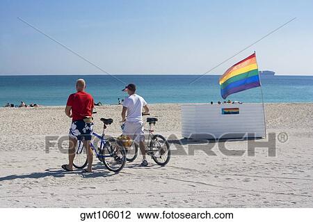 Rear view of two people walking on the beach, South Beach, Miami, Florida, USA View Large Photo Image Stock Image - Rear view of two people walking on the beach, South Beach, Miami, Florida, USA. Fotosearch