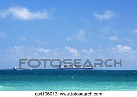 Ship and a boat in the sea, South Beach, Miami, Florida, USA View Large Photo Image Stock Image - Ship and a boat in the sea, South Beach, Miami, Florida, USA. Fotosearch