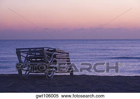Stack of folded lounge chairs on the beach, South Beach, Miami, Florida, USA View Large Photo Image Stock Photography - Stack of folded lounge chairs on the beach, South Beach, Miami, Florida, USA. Fotosearch