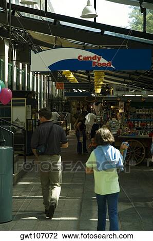 Stock Image - Group of tourist in a market, Boston, Massachusetts, USA. Fotosearch