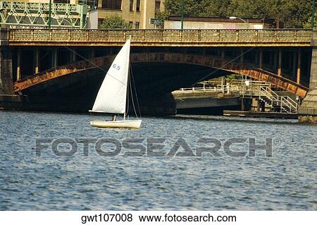 Sailboat in a river near an arch bridge, Boston, Massachusetts, USA View Large Photo Image Stock Photo - Sailboat in a river near an arch bridge, Boston, Massachusetts, USA. Fotosearch