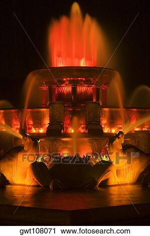 Close-up of a fountain lit up at night, Clarence Buckingham Fountain, Chicago, Illinois, USA View Large Photo Image Stock Image - Close-up of a fountain lit up at night, Clarence Buckingham Fountain, Chicago, Illinois, USA. Fotosearch