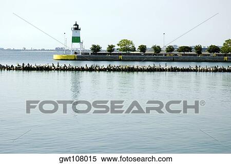 Lighthouse in the sea, Chicago Harbor Lighthouse, Chicago, Illinois, USA View Large Photo Image Stock Photography - Lighthouse in the sea, Chicago Harbor Lighthouse, Chicago, Illinois, USA. Fotosearch