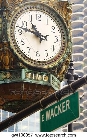 Low angle view of a clock, Chicago, Illinois, USA View Large Photo Image Stock Photo - Low angle view of a clock, Chicago, Illinois, USA. Fotosearch