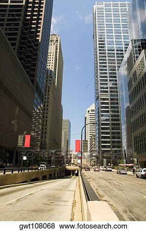 Low angle view of skyscrapers in a city, Chicago, Illinois, USA View Large Photo Image Stock Photo - Low angle view of skyscrapers in a city, Chicago, Illinois, USA. Fotosearch