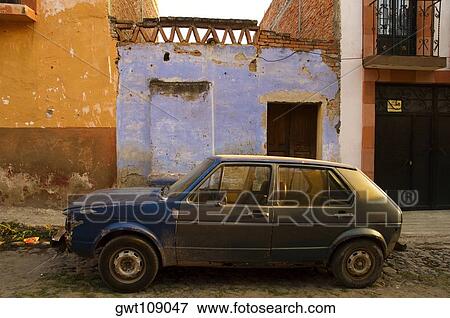 Stock Photo - Car parked in front of a house, Mexico. Fotosearch