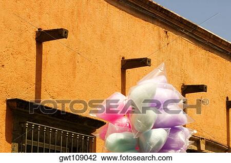 Close-up of cotton candy in front of a building, Mexico View Large Photo Image Stock Image - Close-up of cotton candy in front of a building, Mexico. Fotosearch