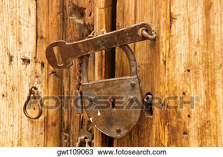 Stock Image - Close-up of the broken lock on a door. Fotosearch