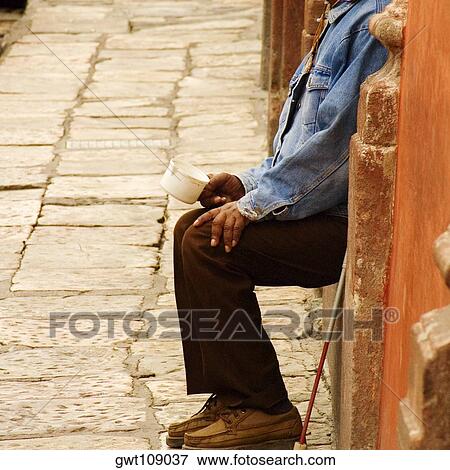 Side profile of a blind man holding a cup, Mexico View Large Photo Image Stock Photo - Side profile of a blind man holding a cup, Mexico. Fotosearch