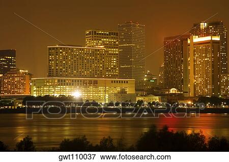 Buildings in a city lit up at night, New Orleans, Louisiana, USA View Large Photo Image Stock Photo - Buildings in a city lit up at night, New Orleans, Louisiana, USA. Fotosearch
