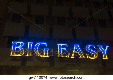 Picture - Low angle view of a neon sign, New Orleans, Louisiana, USA. Fotosearch