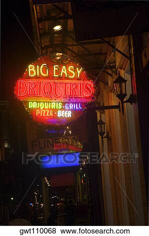 Low angle view of commercial sign lit up at night, New Orleans, Louisiana, USA View Large Photo Image Stock Photo - Low angle view of commercial sign lit up at night, New Orleans, Louisiana, USA. Fotosearch