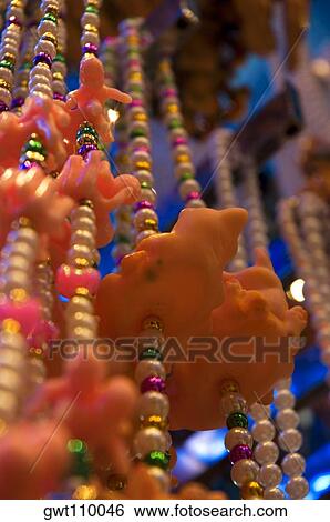 Stock Photograph - Low angle view of necklaces, New Orleans, Louisiana, USA. Fotosearch