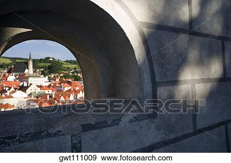 Buildings in a city seen through an arch, Prague, Czech Republic View Large Photo Image Stock Photo - Buildings in a city seen through an arch, Prague, Czech Republic. Fotosearch