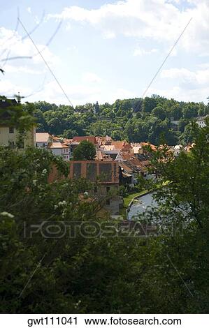 Stock Image - Buildings on the banks of a river, Czech Republic. Fotosearch