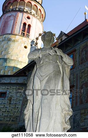 Stock Photo - Low angle view of a statue in front of a building, Czech Republic. Fotosearch