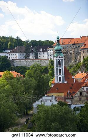 Tower in front of buildings in a city, Old Town Square, Prague, Czech Republic View Large Photo Image Picture - Tower in front of buildings in a city, Old Town Square, Prague, Czech Republic. Fotosearch