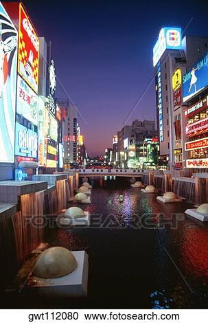 Buildings along a river, Dotombori River, Osaka, Japan View Large Photo Image Stock Image - Buildings along a river, Dotombori River, Osaka, Japan. Fotosearch
