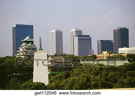 Castle and skyscrapers in a city, Osaka Castle, Osaka, Japan View Large Photo Image Stock Photograph - Castle and skyscrapers in a city, Osaka Castle, Osaka, Japan. Fotosearch
